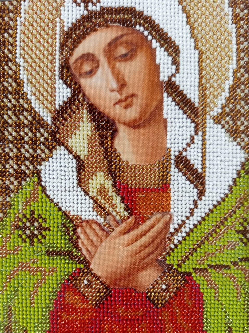 Virgin Mary icon close-up, handmade bead embroidery detail