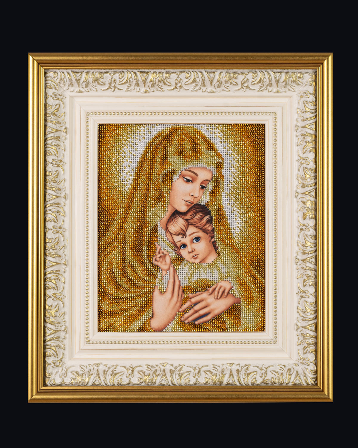 Gold Madonna original bead embroidery depicting the Virgin Mary and Christ Child in an ornate ivory-and-gold frame against a black background.