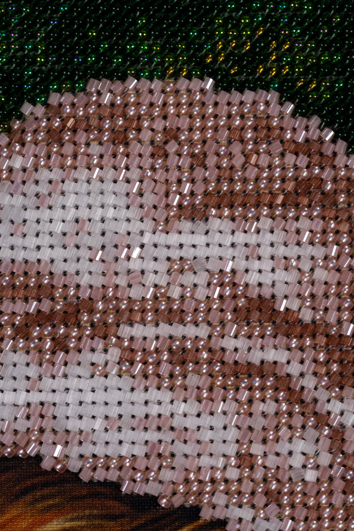 Macro detail of glass seed beads and Matsuno 2-cut beads in the Madonna’s veil