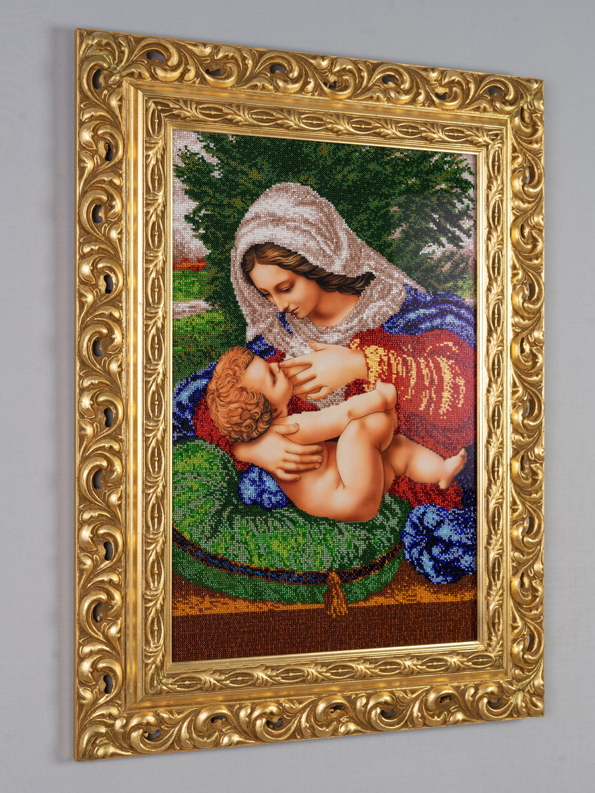 Side view of Madonna and Child in the Garden showing the framed bead embroidery and dimensional presentation