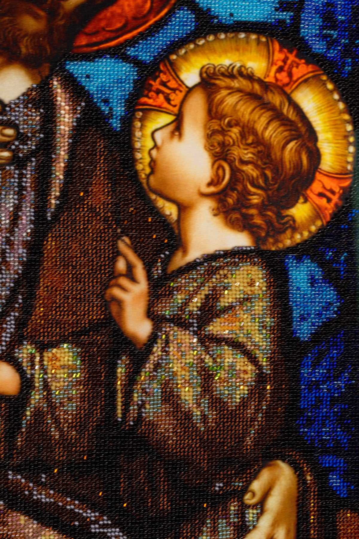Detail of the Child Jesus in St. Joseph & Jesus bead embroidery artwork, showing the halo, garment and hand-beaded surface