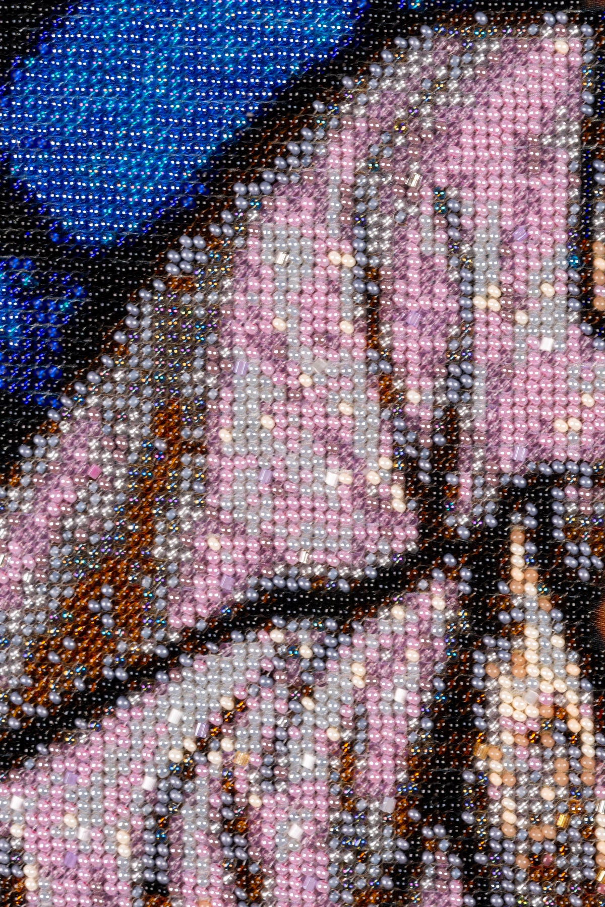 Macro detail of St. Joseph’s robe showing pink, silver, grey and dark Czech PRECIOSA seed beads and intricate hand stitching