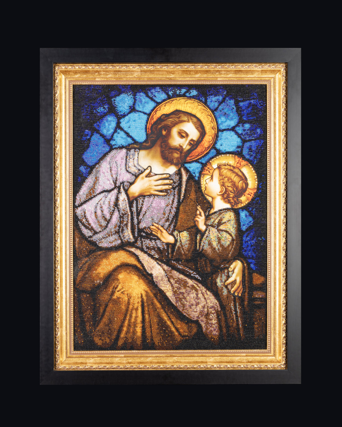 St. Joseph & Jesus original bead embroidery artwork displayed frontally against a dark background in its black and gold frame