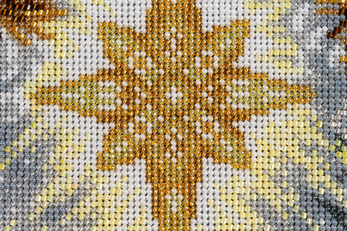 Beaded Star of Bethlehem detail in Incarnation, worked in gold, white, grey and pale yellow beads