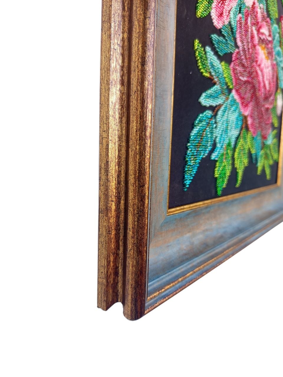 Close-up of the decorative frame and hand-beaded green foliage in Peonies in Bloom