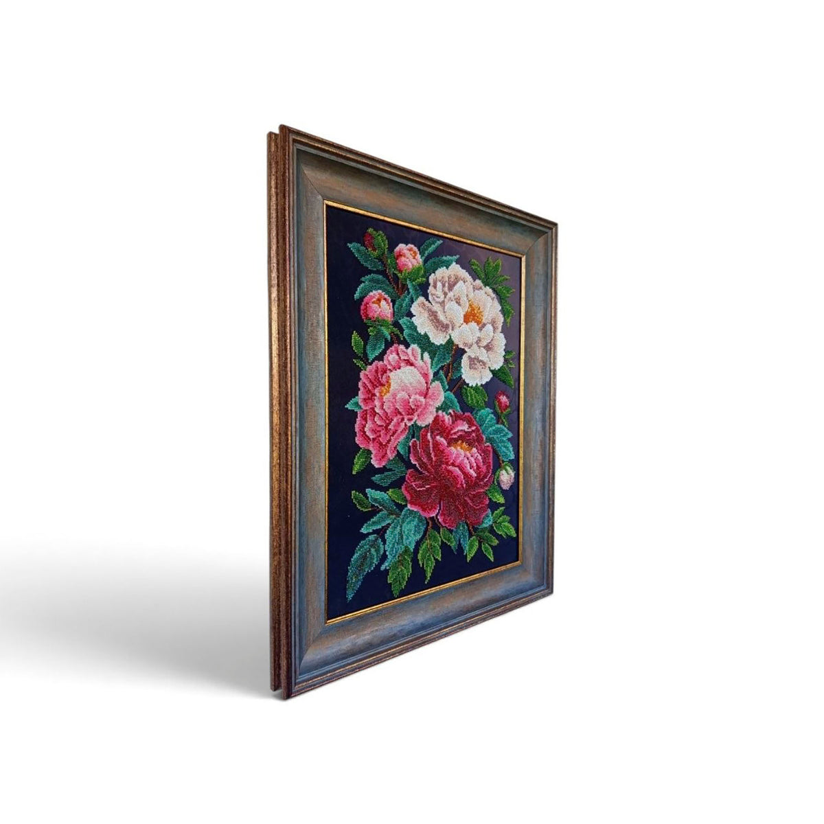 Side view of Peonies showing the framed bead embroidery artwork and depth of the decorative frame
